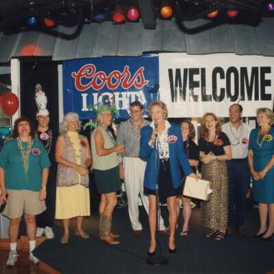 A group of unknown people standing on a stage.