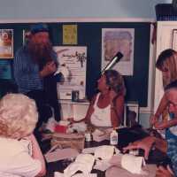 A group of unknown people making face masks.