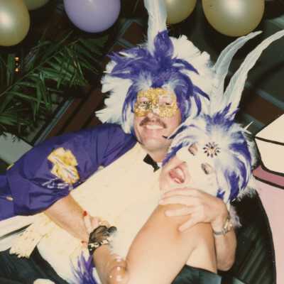 Two unknown people dressed up.