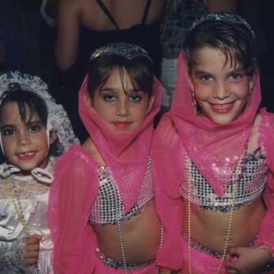 Three unknown little girls dressed up.