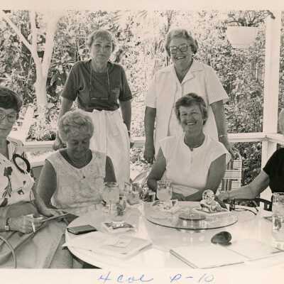 An unknown group of woman around a table