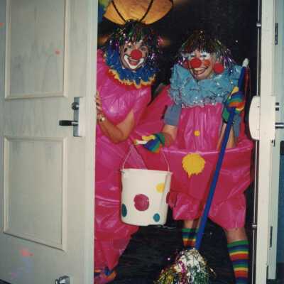 Two unknown people dressed up.