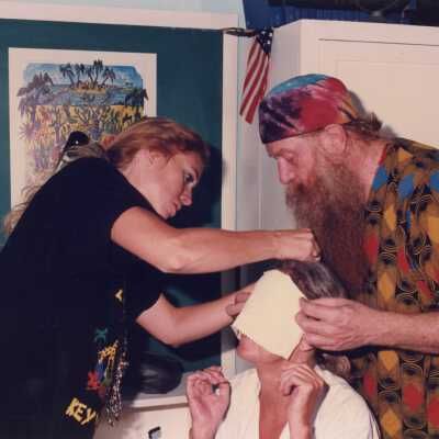 Unknown people making face mask.