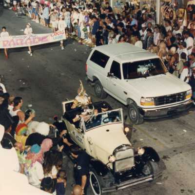 The grand marshal and a white bronco in the parade.