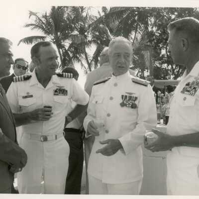A group of unknown men in uniform talking