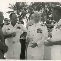 A group of unknown men in uniform talking