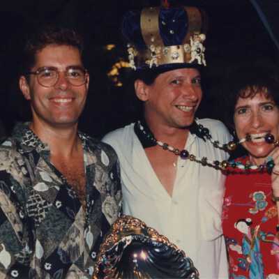 Rita Troxel and two unknown men holding an award at the awards ceremony.