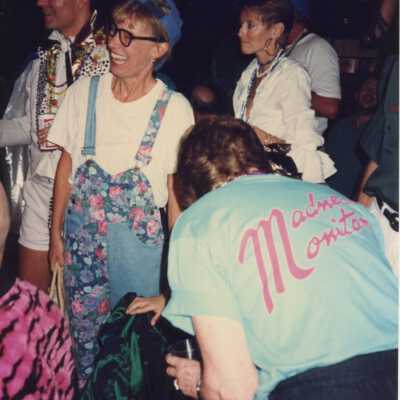 Unknown people standing around.