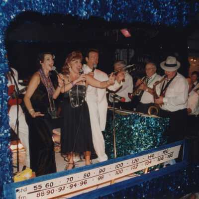 A float in the parade that has a band playing.