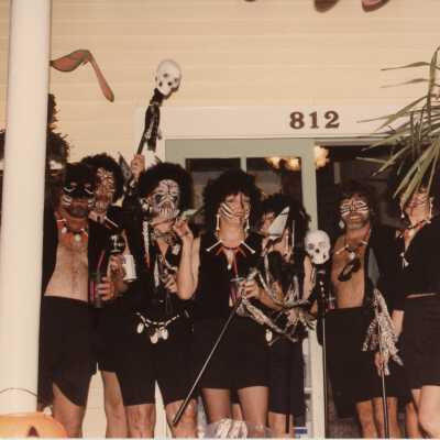 Unknown people dressed up standing in front of the Tropical Inn at 812 Duval Street.