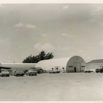 Buildings on base with vehicles parked outside