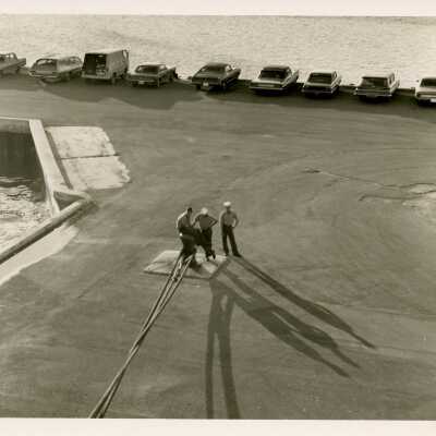 U.S. Navy men in a parking lot