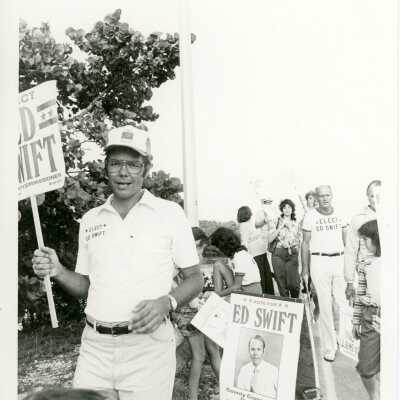 Unknown man holding an election sign