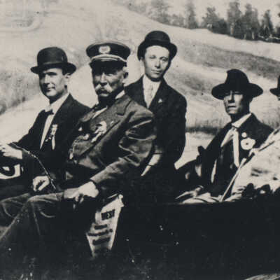 Five men in an open car