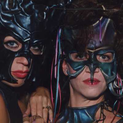 Two unknown people dressed up.