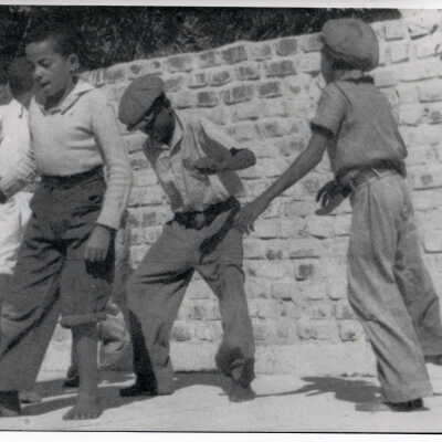 Young Boys Dancing in Front of Hemingway Home