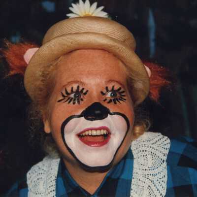 Unknown woman with her face painted.