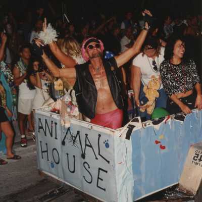 A float in the parade that reads Animal House.