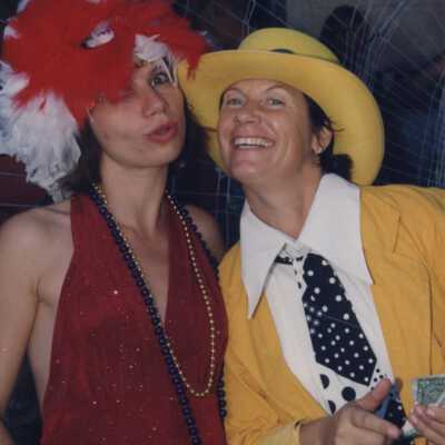 Two unknown people dressed up.