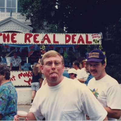 Unknown people walking at the street fair.