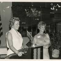 2 Unknown woman at a podium