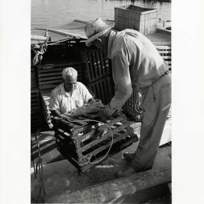 Florida Lobstermen Load Traps Aboard their Boat