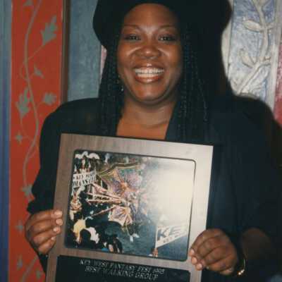 Unknown woman with a plaque.