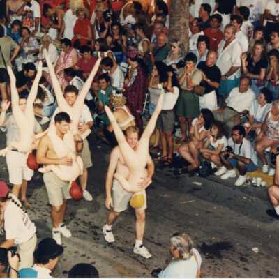 People in the parade walking down Duval Street.