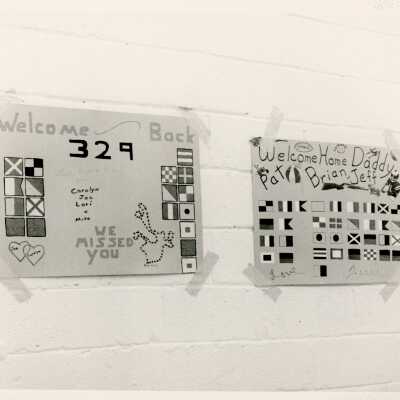 Welcome back signs on a wall