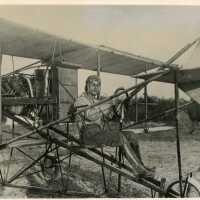 An unknown man sitting in some sort of plane
