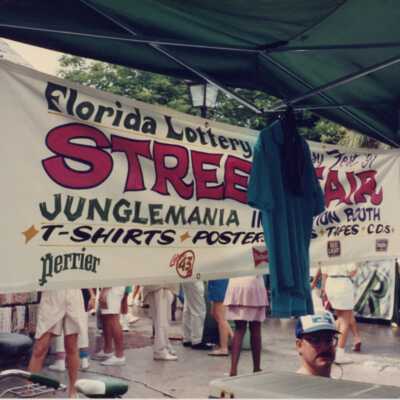 Florida lottery street fair sign and booth.