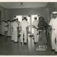 A group of people in uniform inside a building