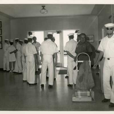 A group of people in uniform inside a building