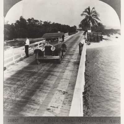 Men and a car on the Boca Chica Bridge