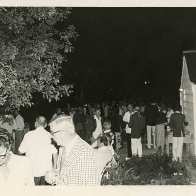 A group of people standing around outside