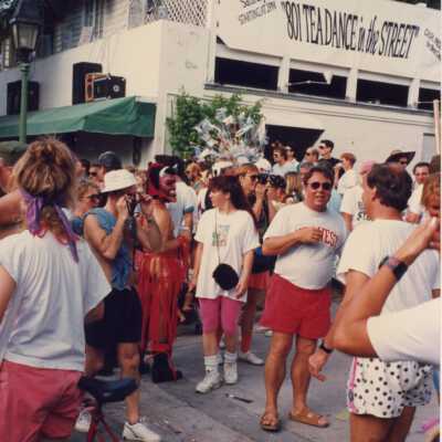 Unknown people in the street in front of the 801 bar on Duval Street.