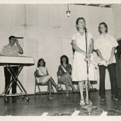 Unknown people on a stage a few at the microphone