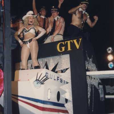 Unknown people dressed up on a float.