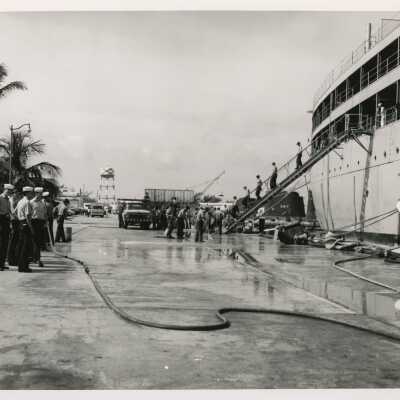 U.S. Navy cleaning a dock and ship