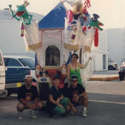 Unknown people in front of a float.