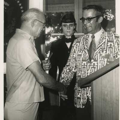 Unknown people standing next to a podium