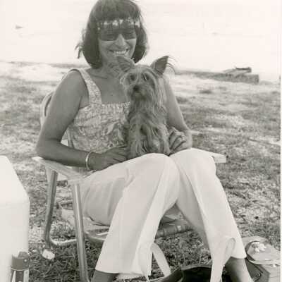 Unknown woman holding a dog