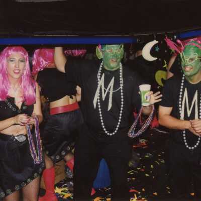 Unknown people dressed up on a float in the parade.