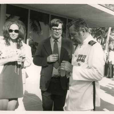 Unknown people standing around at a party