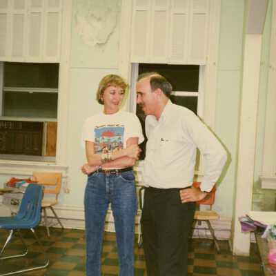 Two unknown people talking.