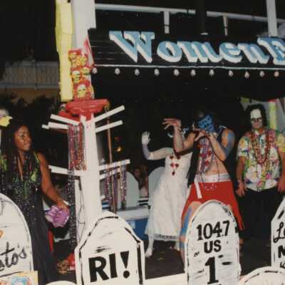 A float in the parade that reads Woman Fest.