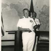 2 Men in uniform standing in a room