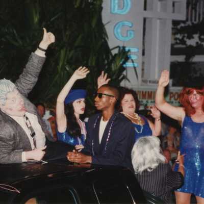 Unknown people dressed up on a float.