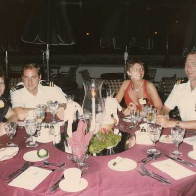 Unknown people sitting at a table at a party
