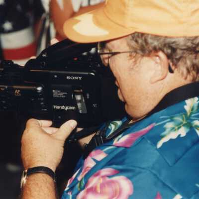 An unknown with a video camera.